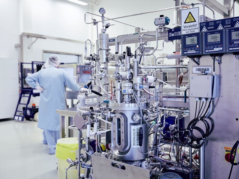 Scientist with bioreactor during the fermentation process of cell cultures for the Life Sciences