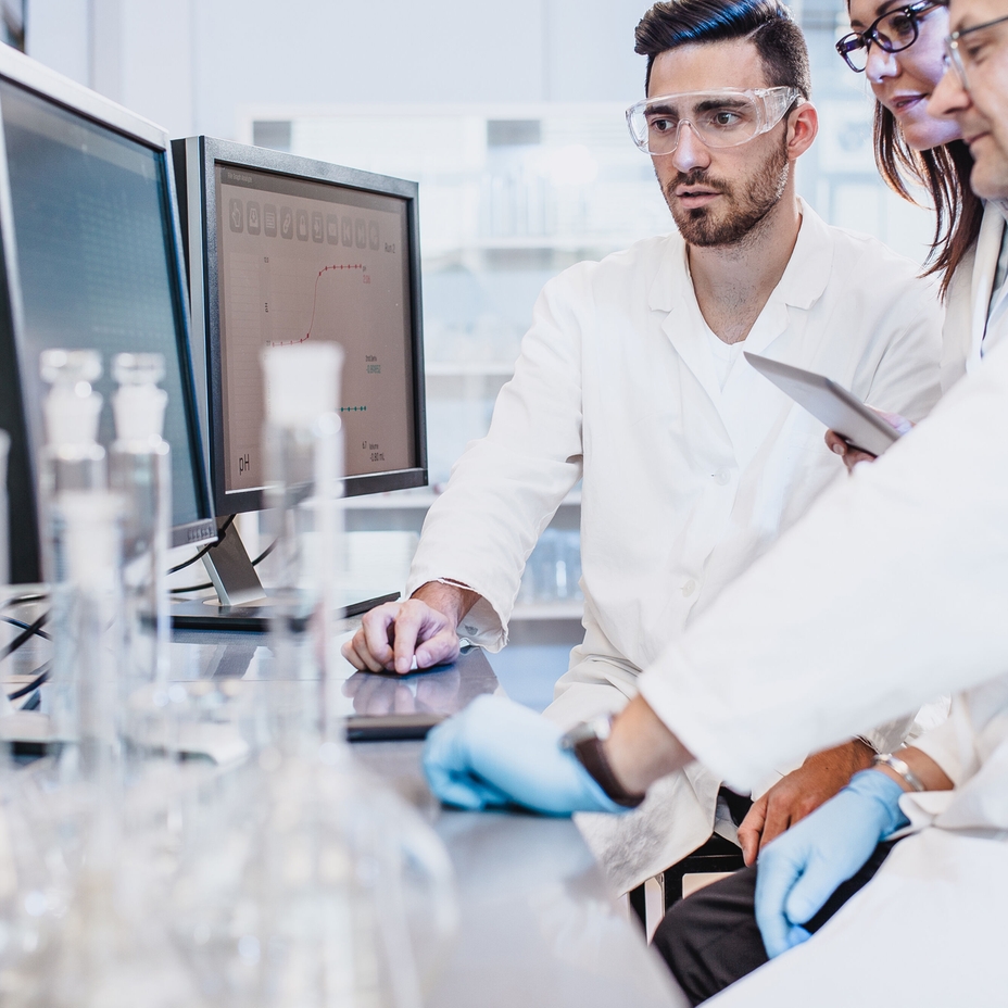 Scientists working in the laboratory looking at computer screen